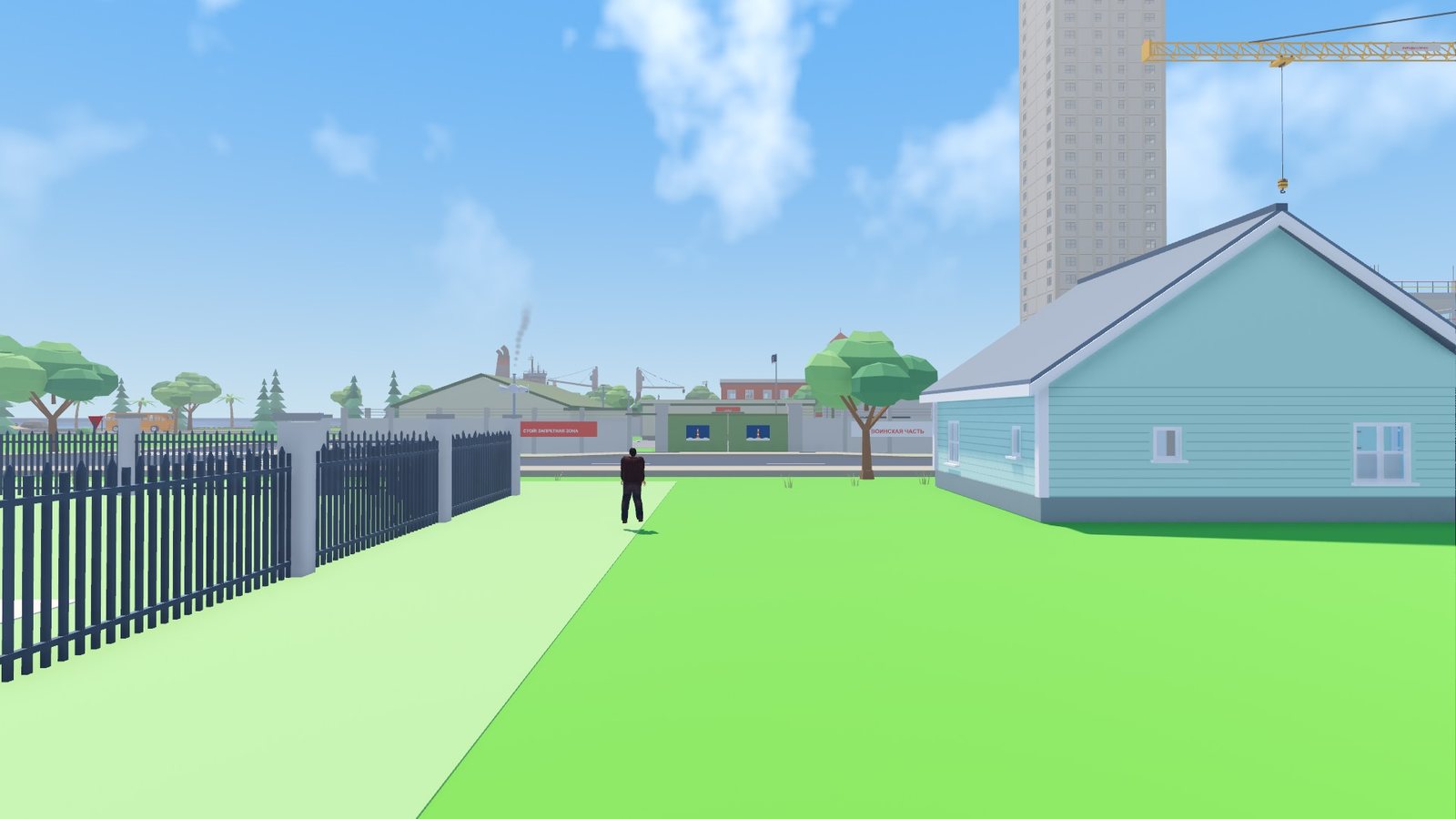 The army base behind its fence, with a guard post